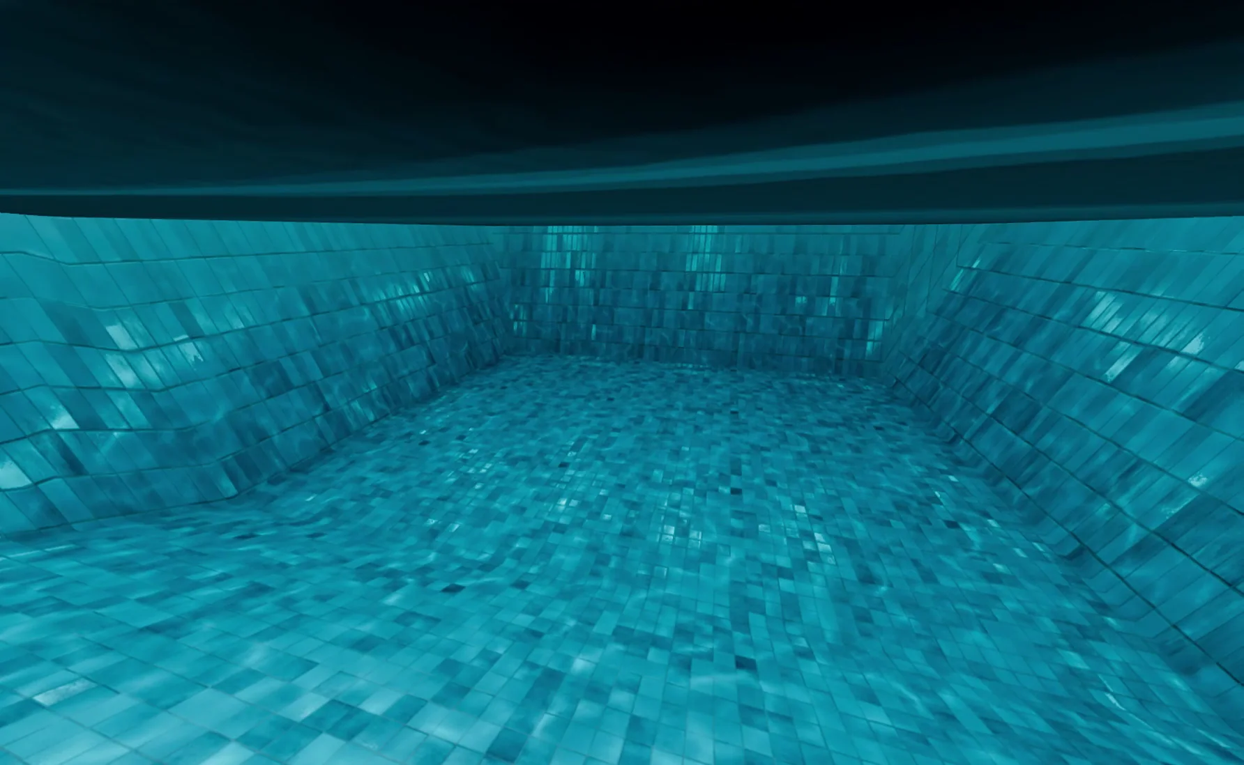 Underwater view of the tiled pool floor and walls in blue